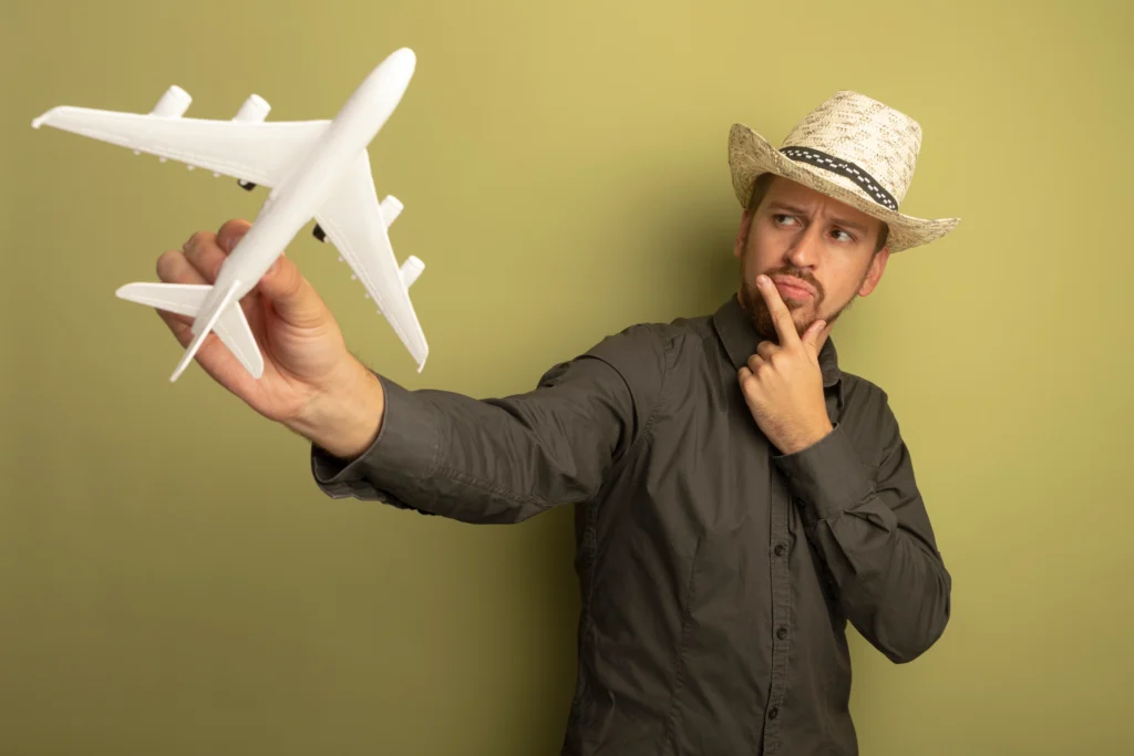 A handsome man is thinking about travelling to get PEEK facial implants abroad